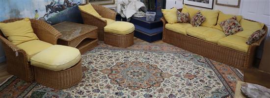 A seven piece wicker conservatory suite with footstools and a coffee table